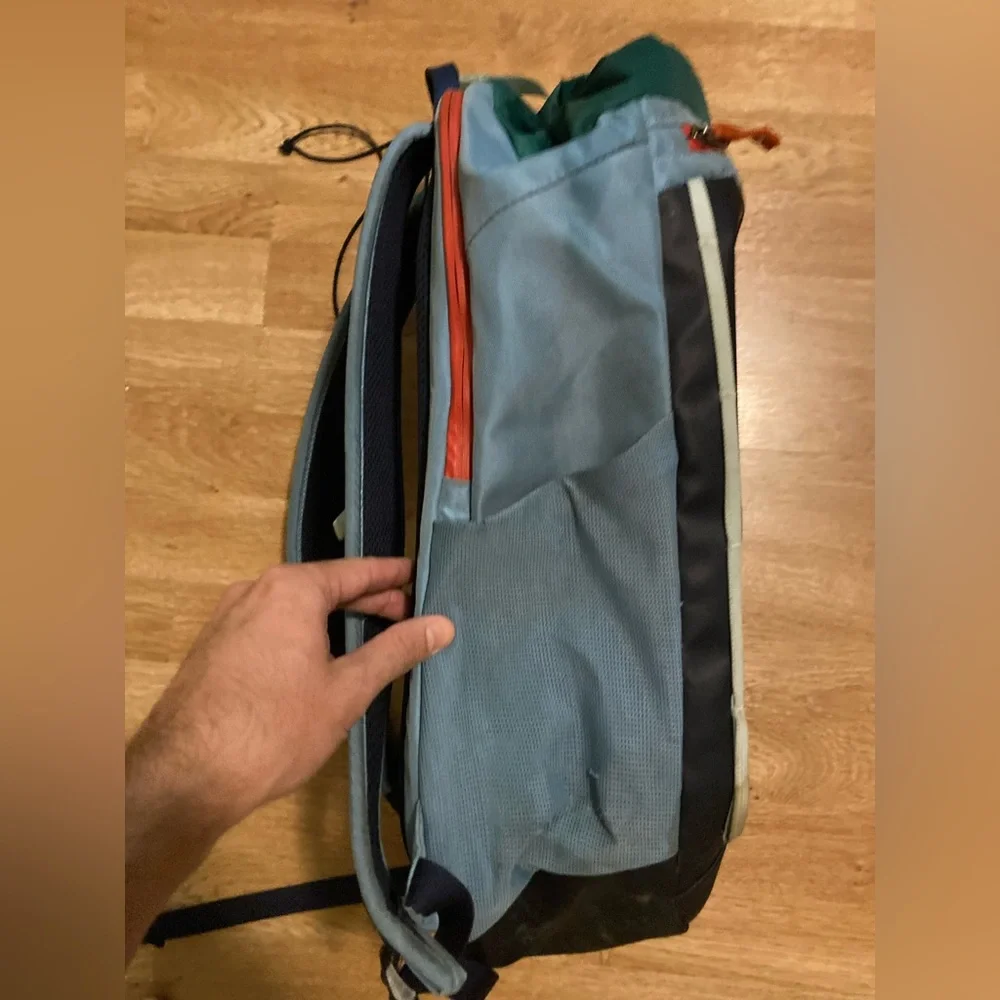 cotopaxi navy blue light blue green striped backpack